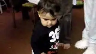 baby chasing dog