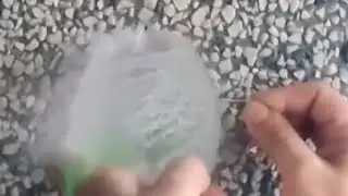 Bursting a water balloon in slow motion at 480 FPS  