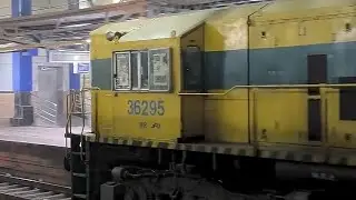CUSTARD YELLOW SHUNTER ENGINE SHUNTS EMPTY TRAIN AT HALT STATION WDS6AD 36295