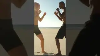 Intense Beach Brawl: Female Fighter vs. Muscular Man - Sand Action!