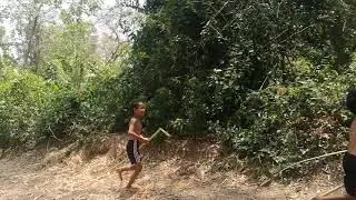 Primitive in Cambodia - Smart boys playing in the forest