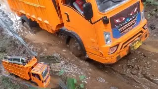 reckless action of RC truck loaded with wood on offroad road