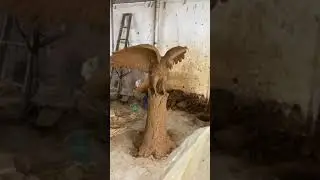 Clay mold of hawk sculpture.