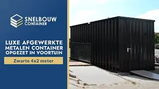 Zwarte 4x2 meter luxe afgewerkte metalen container opgezet in voortuin