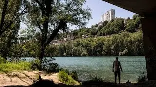 River clean up: French volunteers dive below the Rh&ocirc;ne river to remove rubbish