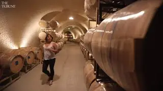 Why do California wineries build wine caves?