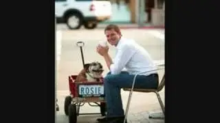 a photo shoot: Justin Rudd with his bulldogs Rosie and Riley