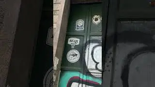 Madrid Street Art: Slaps, Sticker Art, Poster & Graffiti on a garage door