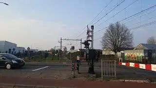 NS VIRMm 9411 passing rail road crossing heading to Maastricht.