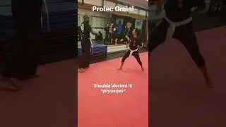students Terrence and Jade practice new white belt stick fencing skills