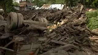 Residents and homes mired in mud after Colombia flooding