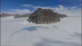 Flying over Flask Glacier, Antarctica with a flyby of camp