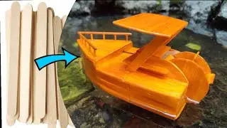 Elastic band powered popsicle boat