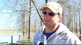 Clay County residents use boats to escape heavily flooded roads