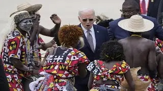 Biden looks shocked by Angolan dance group &mdash; then sleepy at railway summit
