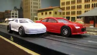 Slot Cars: Super III vs T-Jet: Chevy SS vs Corvette on Model Railroad Layout Chicago & North Western