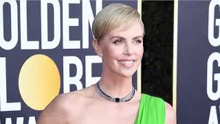 Charlize Theron cuts an androgynous chic look in stripes as she steps out for lunch in LA
