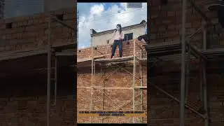 Woman&rsquo;s Impressive Brick - Catching Skill on Scaffold: Precision in Action