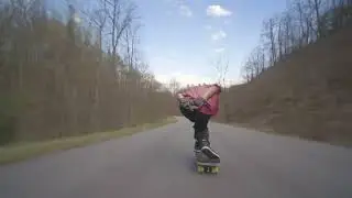 Jesse Fabrizio downhill longboarding a few quick slides