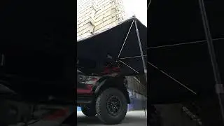 The camping side sunshade is windproof and sun-proof. It has a wide coverage area and with LED light