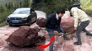 A kind young man cleared away a huge boulder that was blocking traffic for safety reasons.