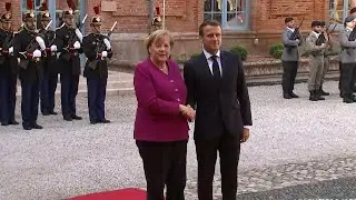 Emmanuel Macron et Angela Merkel arrivent &agrave; Toulouse | AFP Images