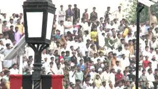 Jinnah's portrait with Pakistani crowd cheering for Flag down ceremony, Wagah border