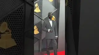 Producer Gesaffelstein hits the Grammys in his iconic metallic mask.