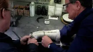 Pewter company owner Martin Aitken removes his own cast