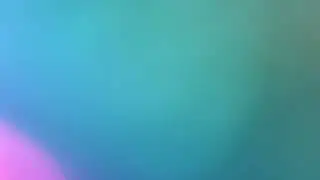 Ethereal blue and green motion color gradient with pink bokeh