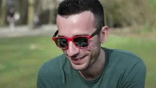 Young Adults Chatting And Smoking At Park Stock Video   Download Video Clip Now   iStock