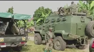 Uganda families hold funerals for 38 students killed in school massacre
