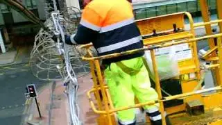Removing the Christmas lights on Glasgow's George Square.