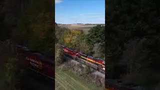 CPKC grainer approaches the grain bins on the Mexico Sub #drone #train #cpkc #sd90mac #kcs