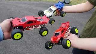 2 Team losi Mini-T 2.0 40th anniversary limited  buggies driving around driveway.