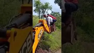 Two person fall in buldose