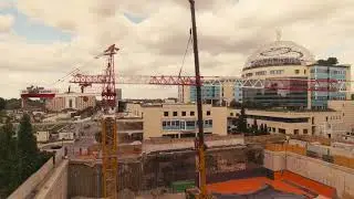 Erection tower cranes POTAIN MD 365 & MD 265 italian hospital 'San Raffaele' in Milano city