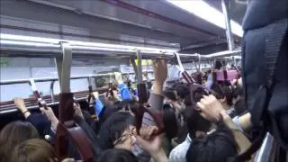 Crowded subway in Seoul Korea ( 서울 한국 ) on the way to the K-POP concert (2012).