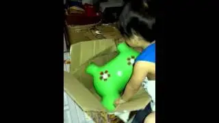 Juanch opening his christmas gift