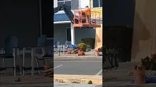 Fixing outdoor frame around windows at the Commander Hotel Ocean City Maryland Boardwalk.