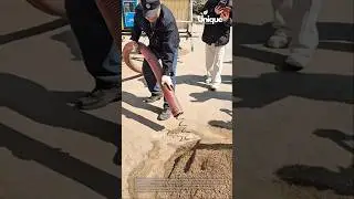 Construction machine in action: moving sand fast