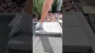 Laying concrete blocks to create a stable outdoor step platform