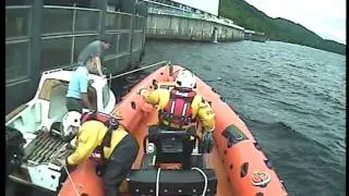 Loch Ness RNLI rescue two sailors caught against Hydro Station sluice gates.