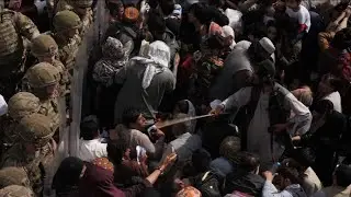 Thousands crowd Kabul's airport in hopes of escape