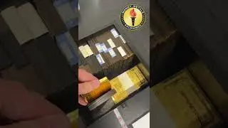 Fat Gold Stack of Goldbacks Beside A Kilo Gold Bar