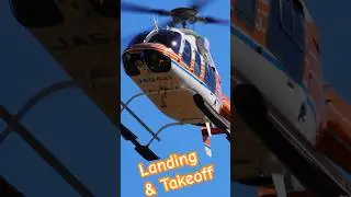 One Bell 407 Helicopter lands and the other takes off