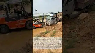 Heavy Duty Rescue: Forklift Saves Trapped Truck in Muddy Mess!