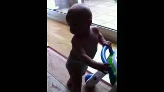 Harry trying to walk at 9 months