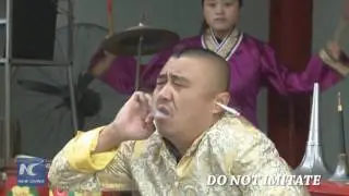 Smoking with ear! Chinese artist shows stunning skills