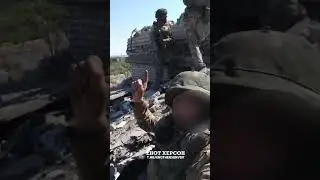 Russian soldiers raise flag in Chasov Yar
